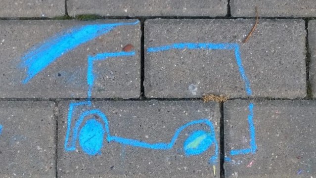 Schematyczny rysunek samochodu wykonany przez dziecko.